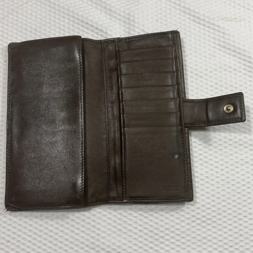 Gucci Dark Brown Embossed Clutch wallet inside is clean. GUC much life left!
